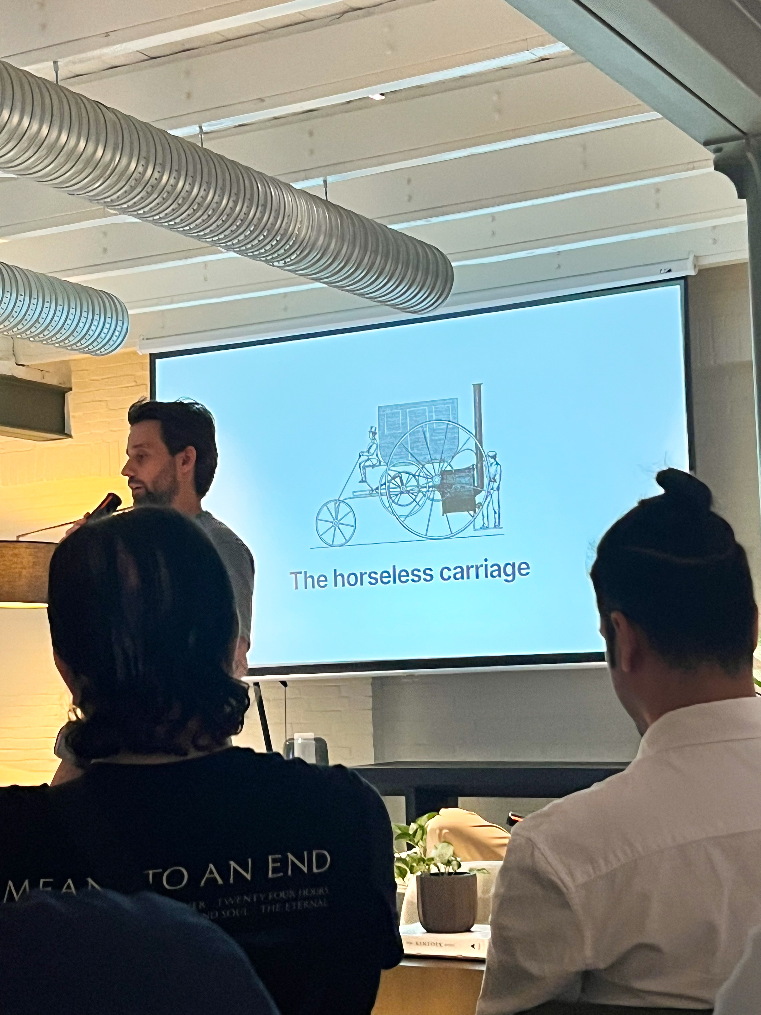 A talk slide and speaker during the Agentic AI event.